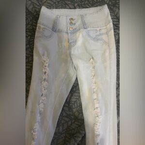 Woman’s small, worn only a couple of times, light blue jeans.
